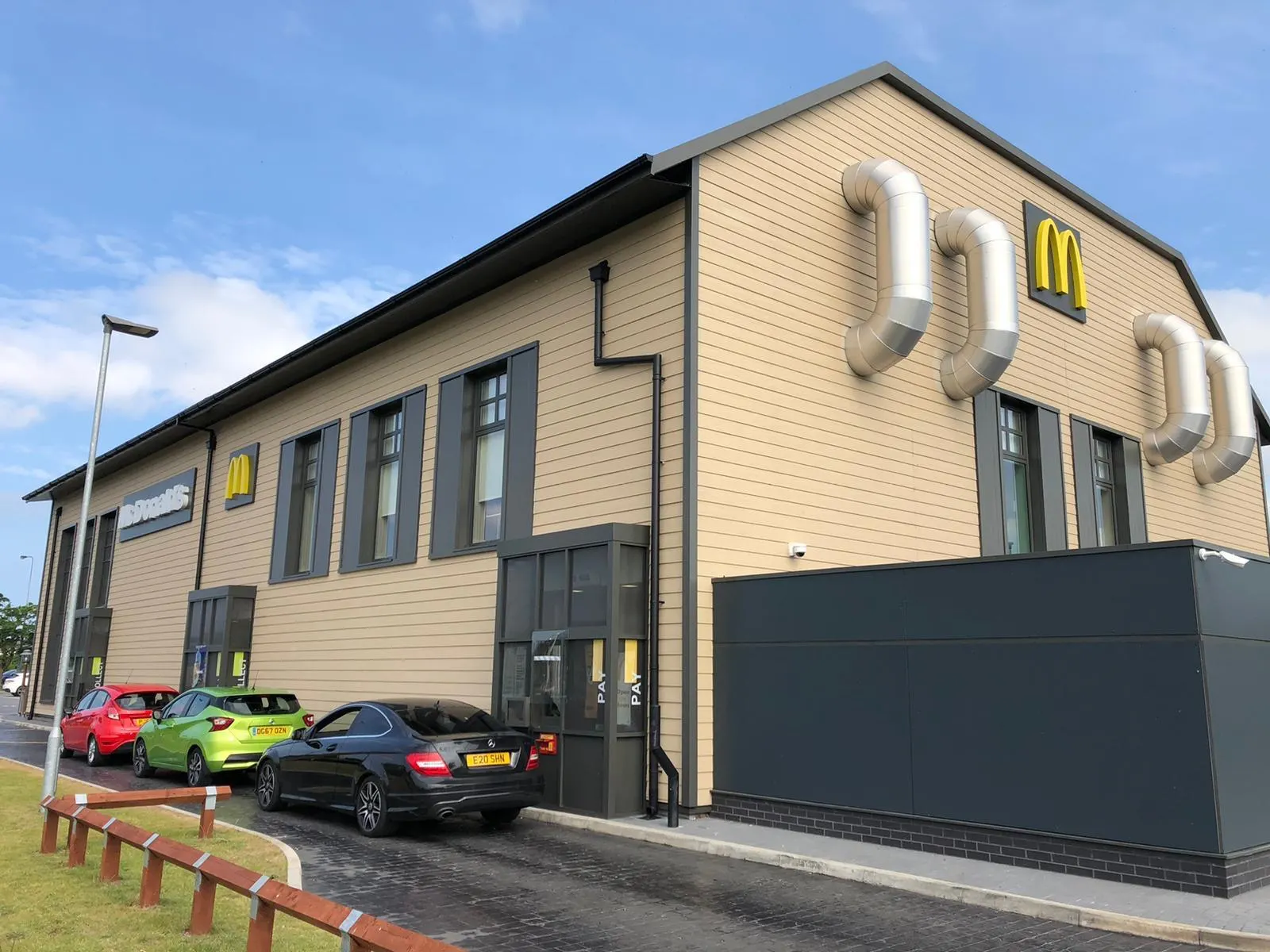 Drive-thru restaurant exterior with painted cladding