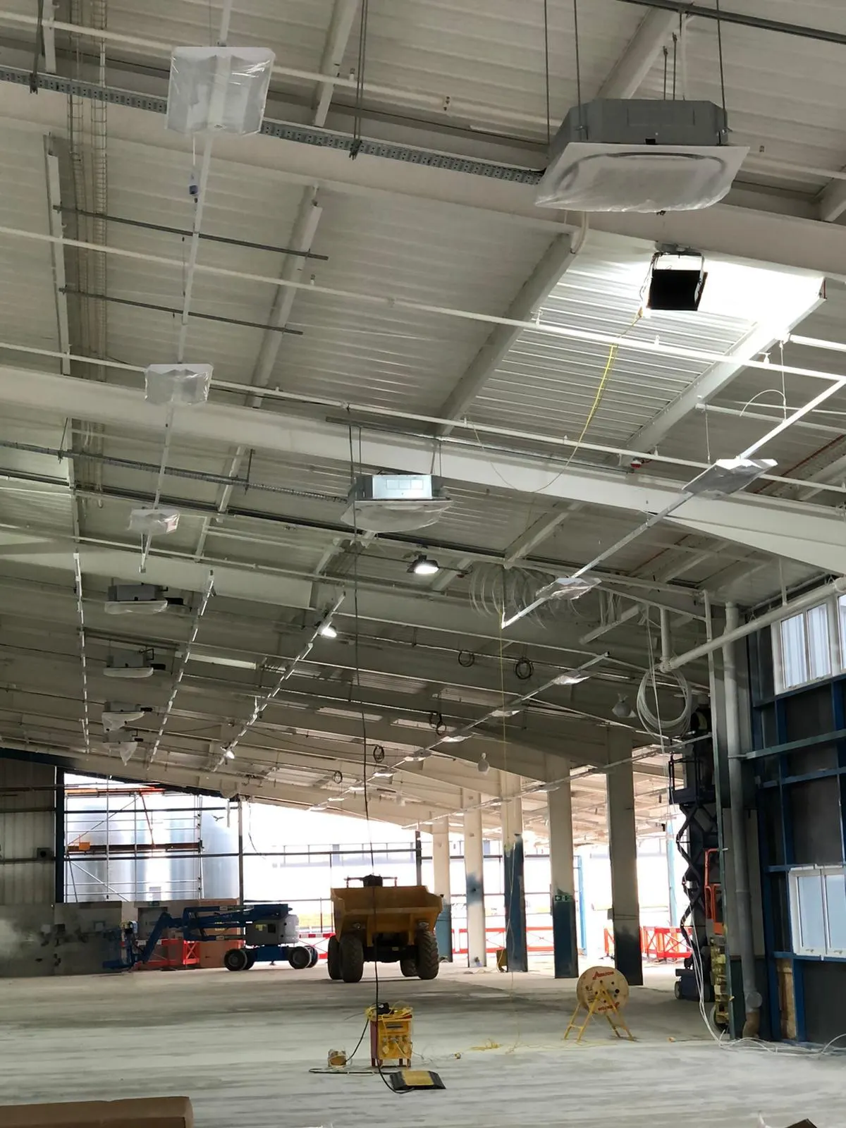 Car showroom under construction with painted ceiling steelwork