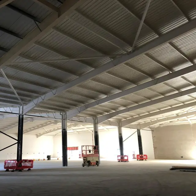 Painted roof steelwork in a large retail unit during fit-out