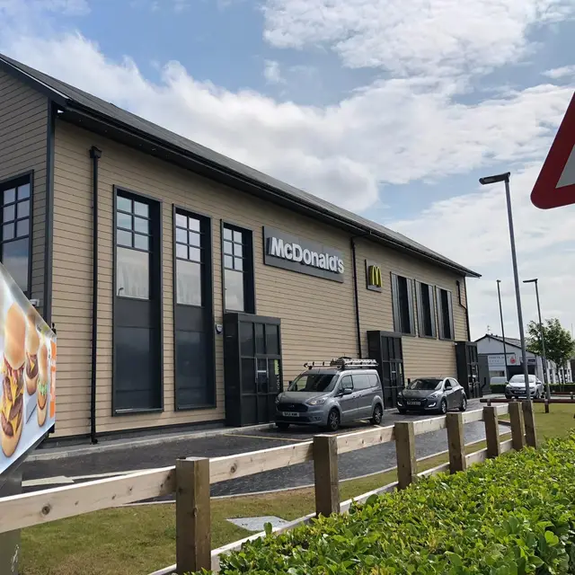 Drive-thru restaurant exterior with freshly painted cladding