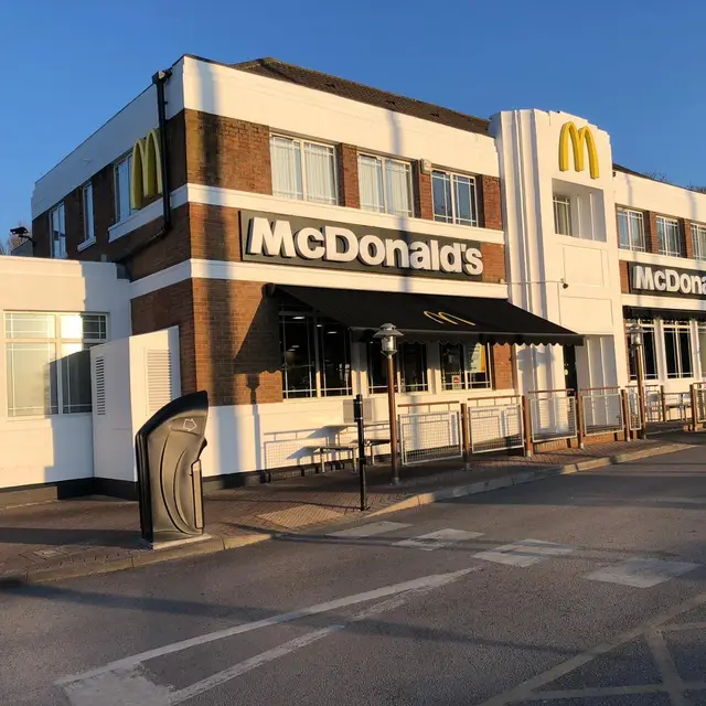 Refurbished restaurant exterior with white painted render and brickwork