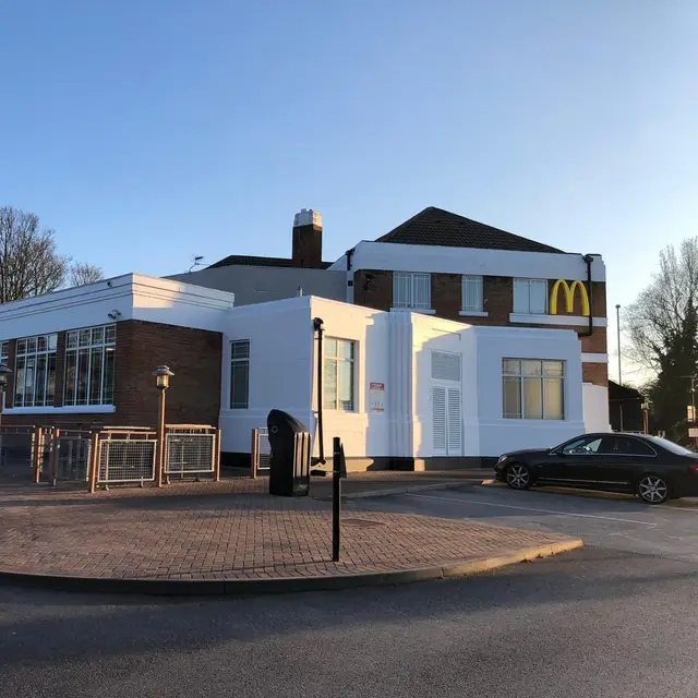 Restaurant exterior decorated in white with painted railings