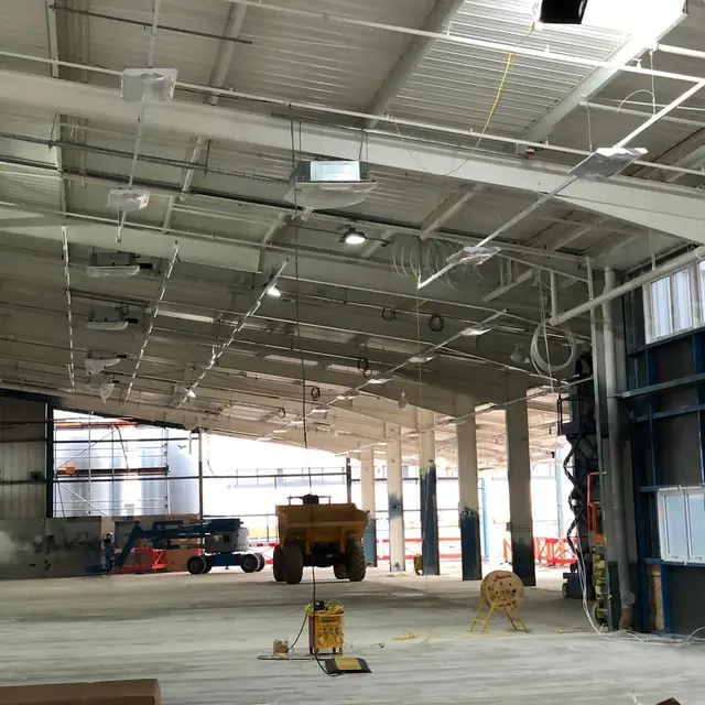 Car showroom under construction with painted ceiling steelwork