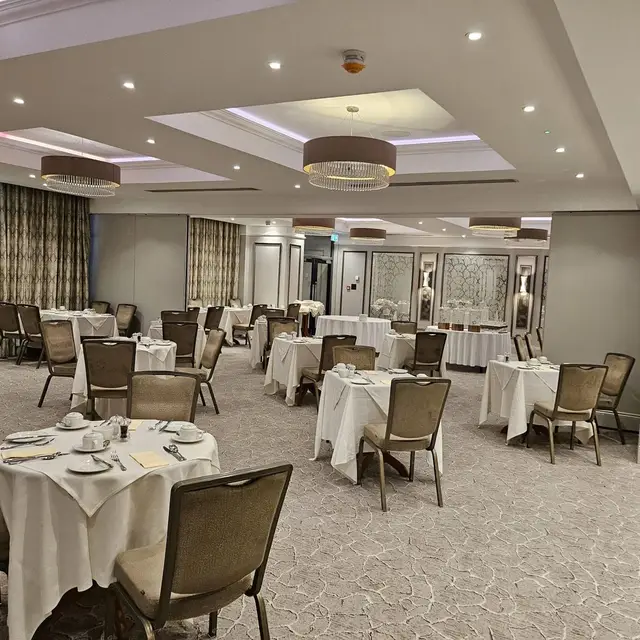 Care home dining room decorated in soft grey and neutral tones