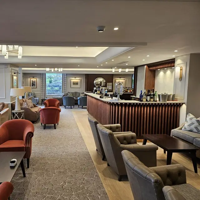 Care home lounge bar decorated in neutral tones