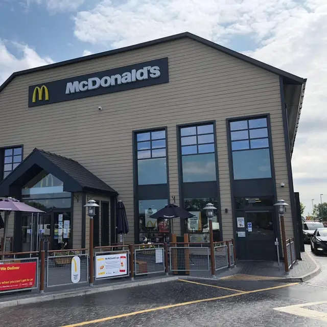 Drive-thru restaurant front elevation with painted cladding