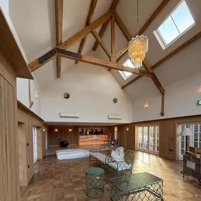 Event space with exposed oak trusses and panelled walls