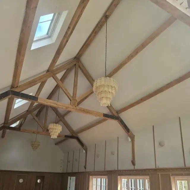 Function room with exposed oak trusses and white painted walls