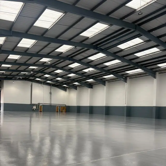 Warehouse with freshly painted walls and grey floor coating