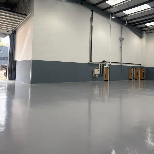 Warehouse interior with white and charcoal painted walls