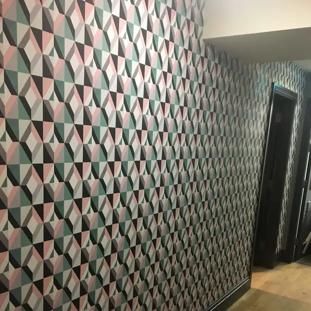 Geometric feature wallpaper in a commercial interior